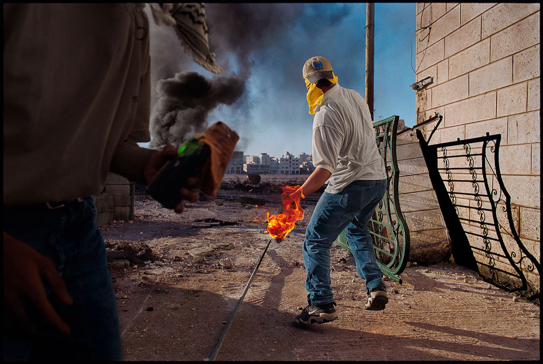 Ramallah, West Bank, 2000. At the beginning of the second Palestinian uprising, demonstrators hurled Molotovs at Israeli troops.